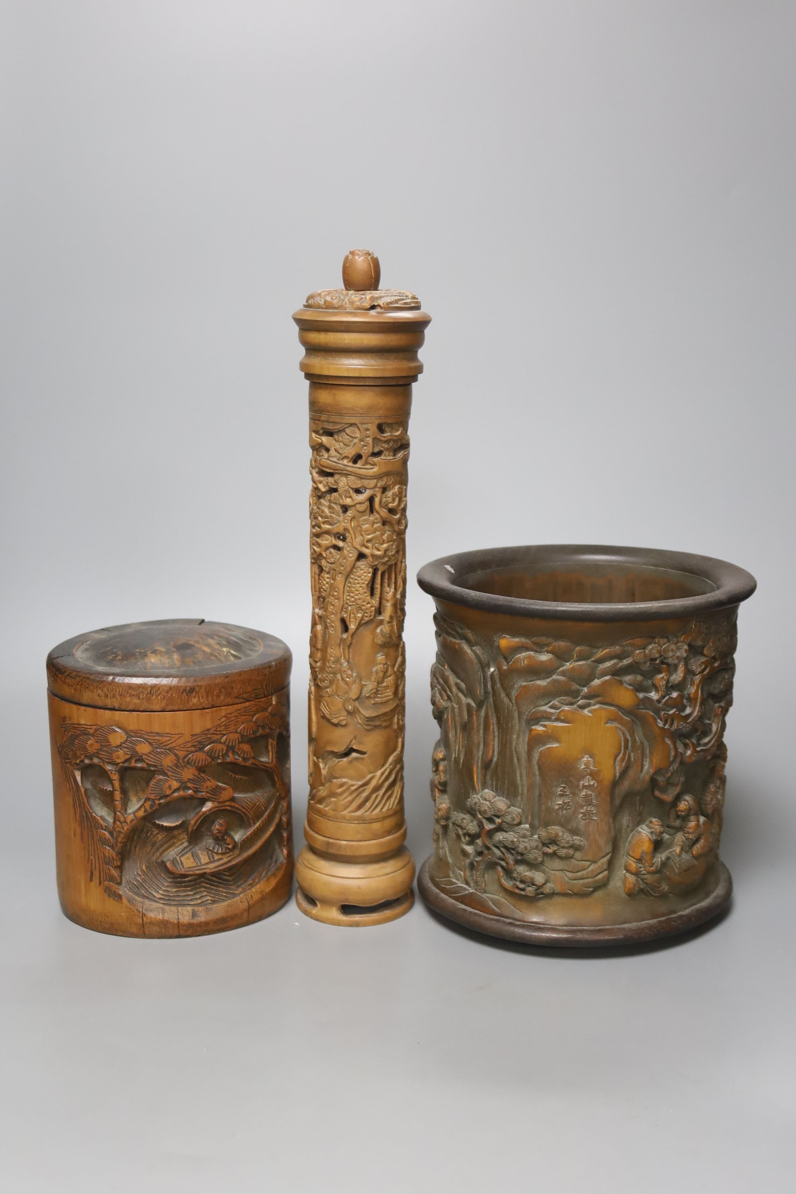 Three Chinese carved bamboo brushpots, largest 16cm diameter 17cm high, together with a carved bamboo scroll box and a carved hardwood plate stand (6)